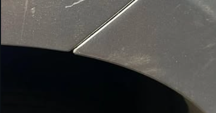 Close-up detail of a precisely refinished panel edge